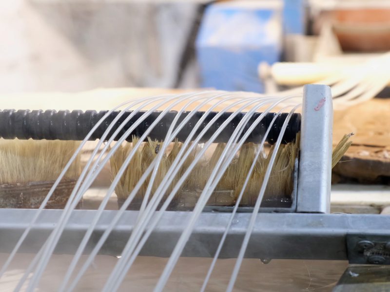 Recycled,Molten,Plastic,Comes,Out,Of,The,Extruder,Machine,Concept